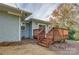 Stained wooden deck located off the back of this home featuring sliding door entrance at 8607 Larchmont Cir, Charlotte, NC 28214