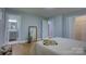Inviting bedroom featuring hardwood floors and ensuite bath, perfect for relaxation at 8607 Larchmont Cir, Charlotte, NC 28214