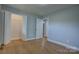 Empty bedroom with hardwood floors and spacious closet, offering versatile living space at 8607 Larchmont Cir, Charlotte, NC 28214