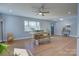 Bright dining area features hardwood floors, natural light, and a modern ceiling fan at 8607 Larchmont Cir, Charlotte, NC 28214
