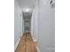 Hallway with hardwood floors and access to multiple rooms at 8607 Larchmont Cir, Charlotte, NC 28214