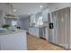 Contemporary kitchen with granite counters, stainless appliances, and ample cabinet space at 8607 Larchmont Cir, Charlotte, NC 28214