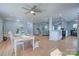 Spacious living area with hardwood floors, recessed lighting, and an open layout to the kitchen and dining area at 8607 Larchmont Cir, Charlotte, NC 28214