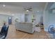 Spacious living room boasts hardwood floors, neutral paint, and an open floor plan at 8607 Larchmont Cir, Charlotte, NC 28214