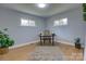Bright office space with hardwood floors, complemented by natural light from two windows at 8607 Larchmont Cir, Charlotte, NC 28214