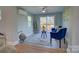 Bright sun room features comfortable seating and sliding doors to the outdoor deck at 8607 Larchmont Cir, Charlotte, NC 28214