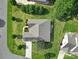 Overhead view of a landscaped property, featuring a well-maintained roof, lush lawn, and hardscaped features at 909 Autumn Glen Ct, Lake Wylie, SC 29710