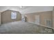 Bedroom featuring neutral walls, carpet, a window, a closet door, and a ceiling light at 909 Autumn Glen Ct, Lake Wylie, SC 29710