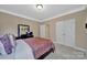 Bedroom featuring neutral walls, carpet, and a closet with double doors at 909 Autumn Glen Ct, Lake Wylie, SC 29710