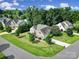 Charming home featuring a manicured lawn, stone accents, and lush landscaping for great curb appeal at 909 Autumn Glen Ct, Lake Wylie, SC 29710