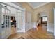 Welcoming home foyer featuring gleaming hardwood floors and an open floor plan at 909 Autumn Glen Ct, Lake Wylie, SC 29710