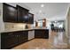 Dark-stained kitchen with stainless steel appliances and adjacent dining area at 909 Autumn Glen Ct, Lake Wylie, SC 29710