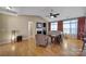 Comfortable living room with fireplace, ceiling fan, and bright natural light at 909 Autumn Glen Ct, Lake Wylie, SC 29710