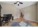 Comfortable office space with hardwood floors, French doors, and ample natural light at 909 Autumn Glen Ct, Lake Wylie, SC 29710