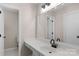 Bright bathroom featuring a white vanity with a large mirror and modern fixtures, alongside a separate toilet room at 9423 Wood Ridge Dr, Charlotte, NC 28277