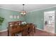 Dining room features a wooden table and a decorative light fixture at 9423 Wood Ridge Dr, Charlotte, NC 28277