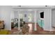 Open-concept living room featuring hardwood floors, white trim, and comfortable seating area at 9423 Wood Ridge Dr, Charlotte, NC 28277
