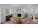 Living room with fireplace and comfortable seating area with shutters and bright natural light at 9423 Wood Ridge Dr, Charlotte, NC 28277