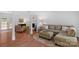 Spacious living room with wood floors, stylish furniture, and plenty of natural light at 9423 Wood Ridge Dr, Charlotte, NC 28277