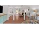 Bright living room featuring hardwood floors, white trim, fireplace, and a comfortable seating area at 9423 Wood Ridge Dr, Charlotte, NC 28277