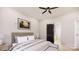 Cozy bedroom featuring a ceiling fan, barn door and a comfortable bed with bedside tables and lamps at 0000 Woodhill Cove Ln # 5, Denver, NC 28037