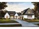 Charming two-story home featuring a well-manicured lawn, an attached two car garage, and a welcoming entrance at 0000 Woodhill Cove Ln # 5, Denver, NC 28037