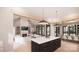 Bright open concept living space with a fireplace, modern furnishings, a kitchen island, and dining area at 0000 Woodhill Cove Ln # 5, Denver, NC 28037