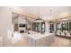 Bright open concept living space with a fireplace, modern furnishings, a kitchen island, and dining area at 0000 Woodhill Cove Ln # 5, Denver, NC 28037
