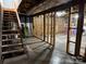Unfinished basement space with exposed beams, staircase, and framed walls ready for customization at 103 Sycamore Rd, Salisbury, NC 28147