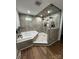 Beautiful bathroom with a glass enclosed shower, a corner soaking tub, and modern fixtures at 103 Sycamore Rd, Salisbury, NC 28147