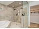 Modern bathroom featuring a separate tub, shower with dual shower heads and wood look floor at 103 Sycamore Rd, Salisbury, NC 28147