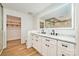 Elegant bathroom with double vanity, marble countertops, walk-in shower, and wood floor at 103 Sycamore Rd, Salisbury, NC 28147