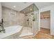 Modern bathroom featuring a separate tub, shower with dual shower heads and wood look floor at 103 Sycamore Rd, Salisbury, NC 28147