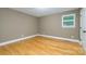 Cozy bedroom with hardwood flooring and a bright window at 103 Sycamore Rd, Salisbury, NC 28147