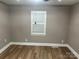 Cozy bedroom featuring hardwood floors and a window, perfect for relaxation and rest at 103 Sycamore Rd, Salisbury, NC 28147