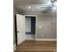 Bedroom featuring hardwood floors, a ceiling fan, and an attached bathroom, offering convenience and style at 103 Sycamore Rd, Salisbury, NC 28147