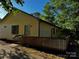 Charming home with a wooden deck, complemented by the lush greenery of mature trees at 103 Sycamore Rd, Salisbury, NC 28147