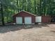Spacious detached two-car garage with white doors, providing ample parking and storage at 103 Sycamore Rd, Salisbury, NC 28147