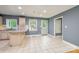 A spacious kitchen area featuring tile flooring and neutral-colored walls at 103 Sycamore Rd, Salisbury, NC 28147
