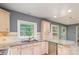 Bright kitchen featuring a window and stainless steel appliances, complemented by elegant countertops at 103 Sycamore Rd, Salisbury, NC 28147