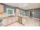 Open kitchen with an island, stainless steel appliances, granite countertops and access to the backyard at 103 Sycamore Rd, Salisbury, NC 28147