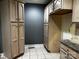 Functional kitchen with ample cabinet space and tile floors, perfect for cooking at 103 Sycamore Rd, Salisbury, NC 28147