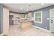 A spacious kitchen area featuring tile flooring, granite countertops, and wood cabinets at 103 Sycamore Rd, Salisbury, NC 28147