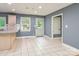 A spacious kitchen area featuring tile flooring and neutral-colored walls at 103 Sycamore Rd, Salisbury, NC 28147