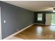 View of the living room with a door with an exterior view of the front yard at 103 Sycamore Rd, Salisbury, NC 28147
