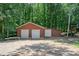 Large outbuilding with garage doors offering ample storage space and potential for various uses at 103 Sycamore Rd, Salisbury, NC 28147