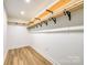 Walk-in closet with custom wood shelving and modern black hardware at 103 Sycamore Rd, Salisbury, NC 28147