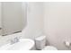 Bright half bathroom with a modern sink, toilet, and a stylish mirror at 1148 Bannockburn Ave, Rock Hill, SC 29732