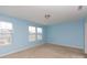 Light-filled bedroom with neutral carpet, ample windows, and a calming blue color at 1148 Bannockburn Ave, Rock Hill, SC 29732