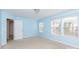 Well-lit bedroom features neutral carpet and is freshly painted in a calming shade of blue at 1148 Bannockburn Ave, Rock Hill, SC 29732